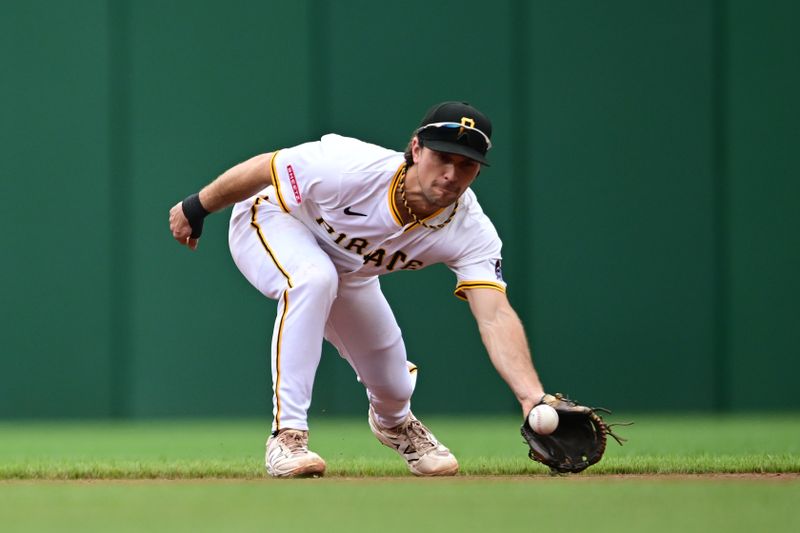 May 4, 2025; Pittsburgh, Pennsylvania, USA; Pittsburgh Pirates second baseman Adam Frazier (26) catches a ball hit by San Diego Padres center fielder Brandon Lockridge (28) during the fifth inning at PNC Park. Mandatory Credit: David Dermer-Imagn Images