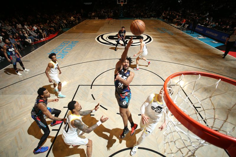 BROOKLYN, NY - JANUARY 29: Cam Thomas #24 of the Brooklyn Nets drives to the basket during the game against the Utah Jazz on January 29, 2024 at Barclays Center in Brooklyn, New York. NOTE TO USER: User expressly acknowledges and agrees that, by downloading and or using this Photograph, user is consenting to the terms and conditions of the Getty Images License Agreement. Mandatory Copyright Notice: Copyright 2024 NBAE (Photo by Nathaniel S. Butler/NBAE via Getty Images)