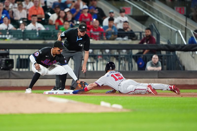 Jul 25, 2024; New York City, New York, USA; New York Mets third baseman Mark Vientos (27) tags out Atlanta Braves right fielder Brian Anderson (15) attempting to steal third base during the ninth inning at Citi Field. Mandatory Credit: Gregory Fisher-USA TODAY Sports