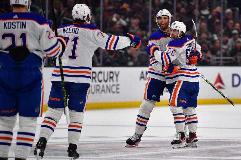 Apr 29, 2023; Los Angeles, California, USA; Edmonton Oilers right wing Kailer Yamamoto (56) celebrates his goal scored against the Los Angeles Kings with defenseman Darnell Nurse (25) and center Ryan McLeod (71) during the third period in game six of the first round of the 2023 Stanley Cup Playoffs at Crypto.com Arena. Mandatory Credit: Gary A. Vasquez-USA TODAY Sports