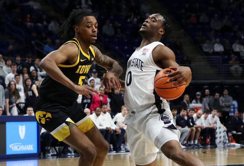 Feb 8, 2024; University Park, Pennsylvania, USA; Penn State Nittany Lions guard Kanye Clary (0) dribbles the ball around Iowa Hawkeyes guard Dasonte Bowen (5) during the first half at Bryce Jordan Center. Penn State defeated Iowa 89-79. Mandatory Credit: Matthew O'Haren-USA TODAY Sports