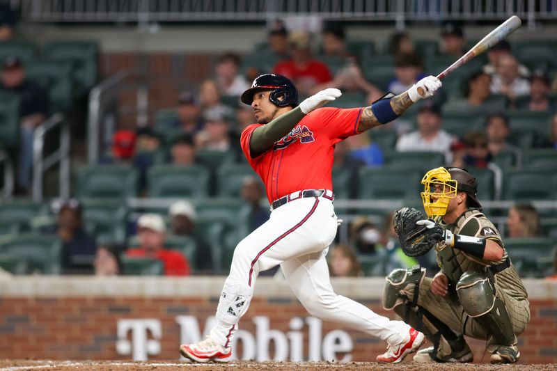 May 17, 2024; Atlanta, Georgia, USA; Atlanta Braves catcher Chadwick Tromp (45) hits a double against the San Diego Padres in the eighth inning at Truist Park. Mandatory Credit: Brett Davis-USA TODAY Sports
