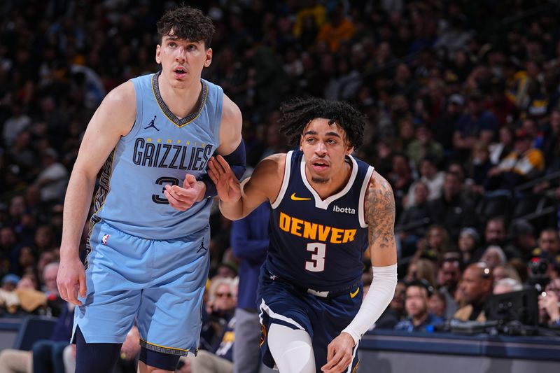 DENVER, CO - MARCH 25: Jake LaRavia #3 of the Memphis Grizzlies plays defense during the game against the Julian Strawther #3 of the Denver Nuggets on March 25, 2024 at the Ball Arena in Denver, Colorado. NOTE TO USER: User expressly acknowledges and agrees that, by downloading and/or using this Photograph, user is consenting to the terms and conditions of the Getty Images License Agreement. Mandatory Copyright Notice: Copyright 2024 NBAE (Photo by Bart Young/NBAE via Getty Images)