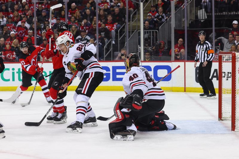 Jan 5, 2024; Newark, New Jersey, USA; New Jersey Devils right wing Alexander Holtz (10) scores a goal against the Chicago Blackhawks during the second period at Prudential Center. Mandatory Credit: Ed Mulholland-USA TODAY Sports