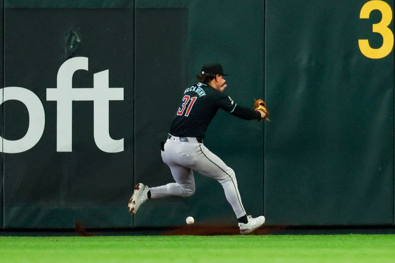 Apr 28, 2024; Seattle, Washington, USA; Arizona Diamondbacks right fielder Jake McCarthy (31) fails to catch a line drive at the wall for a triple against the Seattle Mariners during the third inning at T-Mobile Park. Mandatory Credit: Joe Nicholson-USA TODAY Sports