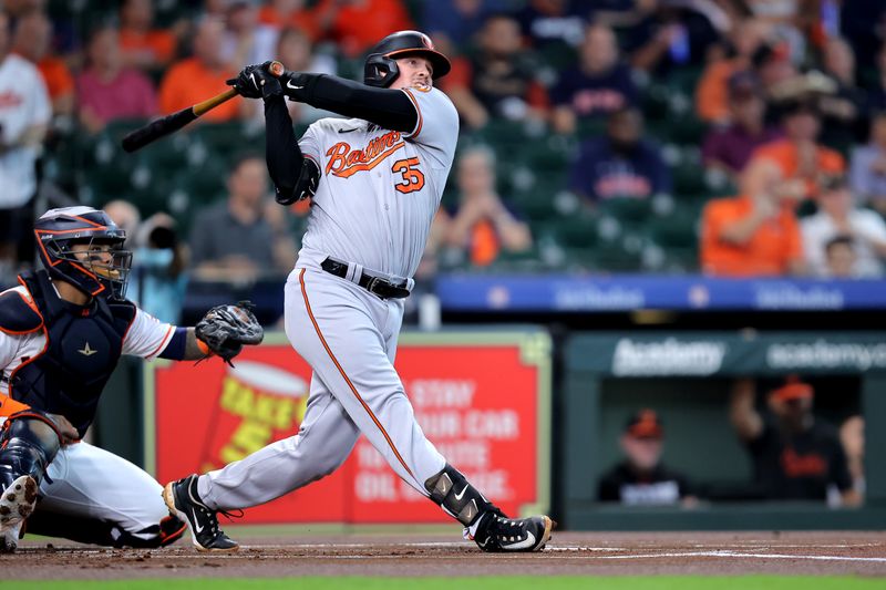 Sep 20, 2023; Houston, Texas, USA; Baltimore Orioles catcher Adley Rutschman (35) hits a double against the Houston Astros during the first inning at Minute Maid Park. Mandatory Credit: Erik Williams-USA TODAY Sports