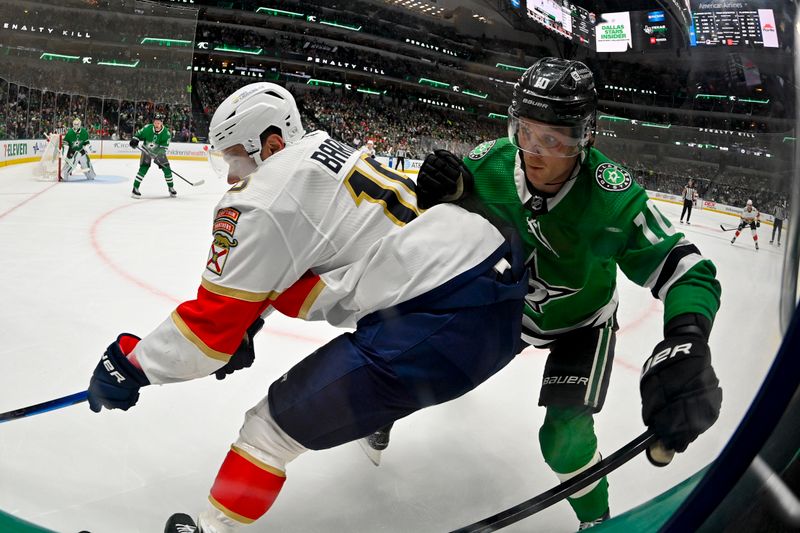 Mar 12, 2024; Dallas, Texas, USA; Florida Panthers center Sam Reinhart (13) and Dallas Stars center Ty Dellandrea (10) battle for control of the puck during the game at the American Airlines Center. Mandatory Credit: Jerome Miron-USA TODAY Sports