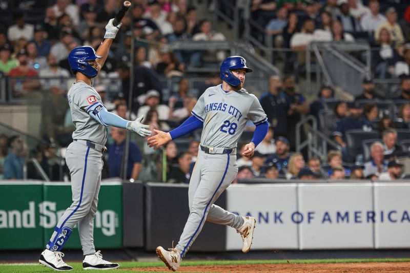 Sep 11, 2024; Bronx, New York, USA; Kansas City Royals center fielder Kyle Isbel (28) scores a run during the seventh inning against the New York Yankees at Yankee Stadium. Mandatory Credit: Vincent Carchietta-Imagn Images