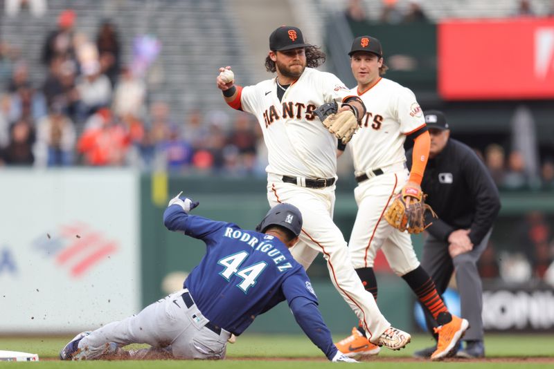 Jul 5, 2023; San Francisco, California, USA; San Francisco Giants shortstop Brandon Crawford (35) turns a double play during the first inning against the Seattle Mariners at Oracle Park. Mandatory Credit: Sergio Estrada-USA TODAY Sports