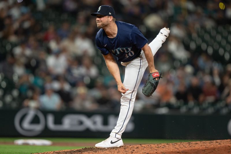 Aug 26, 2024; Seattle, Washington, USA; Seattle Mariners reliever Austin Voth (30) delivers a pitch during the eighth inning against the Tampa Bay Rays at T-Mobile Park. Mandatory Credit: Stephen Brashear-USA TODAY Sports