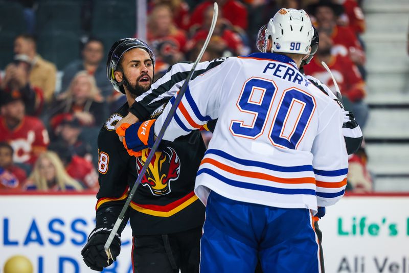 Apr 6, 2024; Calgary, Alberta, CAN; Calgary Flames defenseman Oliver Kylington (58) gets into a scrum with Edmonton Oilers right wing Corey Perry (90) during the first period at Scotiabank Saddledome. Mandatory Credit: Sergei Belski-USA TODAY Sports