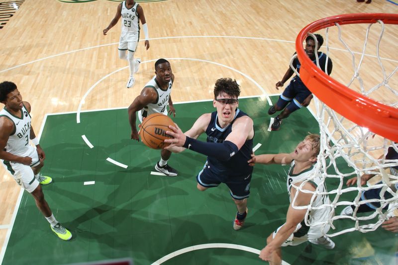 MILWAUKEE, WI - OCTOBER 20: Jake LaRavia #3 of the Memphis Grizzlies shoots the ball during the preseason game on October 20, 2023 at the Fiserv Forum Center in Milwaukee, Wisconsin. NOTE TO USER: User expressly acknowledges and agrees that, by downloading and or using this Photograph, user is consenting to the terms and conditions of the Getty Images License Agreement. Mandatory Copyright Notice: Copyright 2023 NBAE (Photo by Gary Dineen/NBAE via Getty Images).