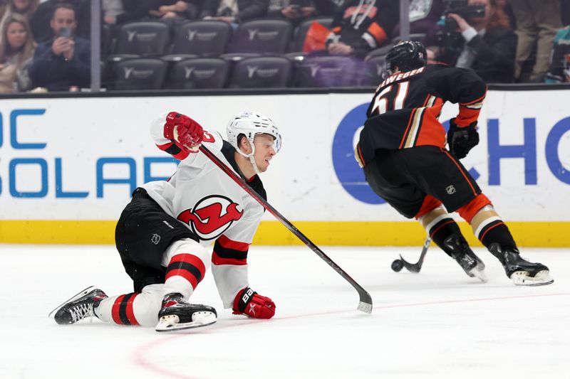 Mar 1, 2024; Anaheim, California, USA; New Jersey Devils left wing Jesper Bratt (63) loses the puck to Anaheim Ducks defenseman Olen Zellweger (51) during the third period at Honda Center. Mandatory Credit: Kiyoshi Mio-USA TODAY Sports