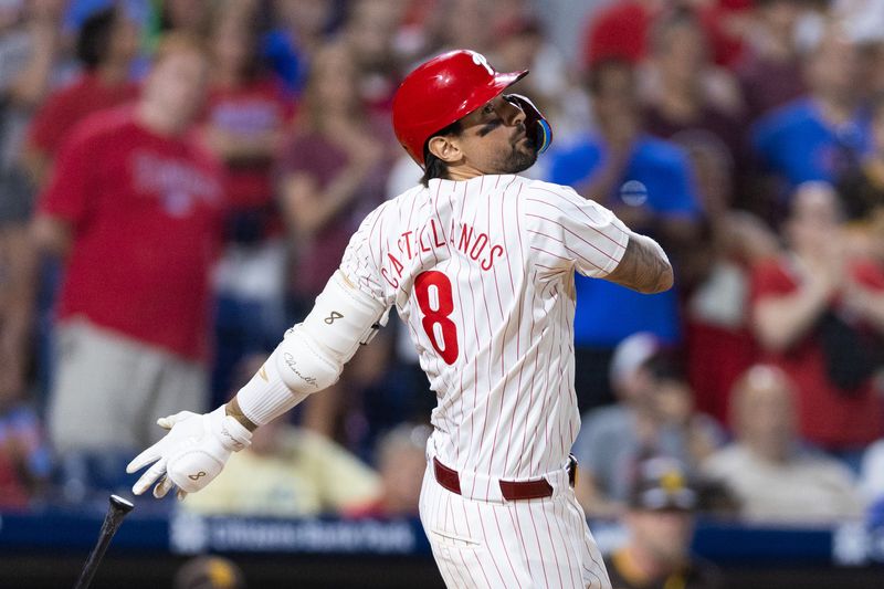Jun 18, 2024; Philadelphia, Pennsylvania, USA; Philadelphia Phillies outfielder Nick Castellanos (8) hits a game winning walk off RBI double during the ninth inning against the San Diego Padres at Citizens Bank Park. Mandatory Credit: Bill Streicher-USA TODAY Sports