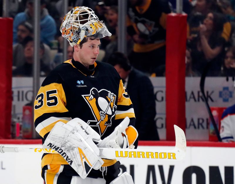 Mar 10, 2024; Pittsburgh, Pennsylvania, USA;  Pittsburgh Penguins goaltender Tristan Jarry (35) returns to his net after a time-out against the Edmonton Oilers during the second period at PPG Paints Arena. The Oilers won 4-0. Mandatory Credit: Charles LeClaire-USA TODAY Sports