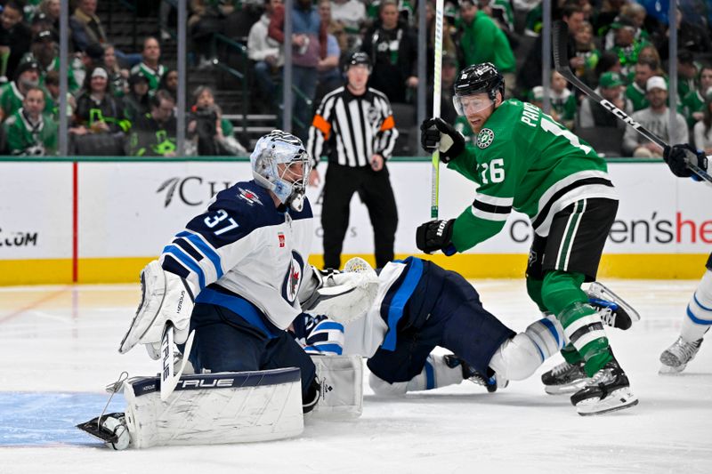 Feb 29, 2024; Dallas, Texas, USA; Dallas Stars center Joe Pavelski (16) checks Winnipeg Jets center Mark Scheifele (55) as goaltender Connor Hellebuyck (37) looks for the puck in the Jets zone during the second period at the American Airlines Center. Mandatory Credit: Jerome Miron-USA TODAY Sports