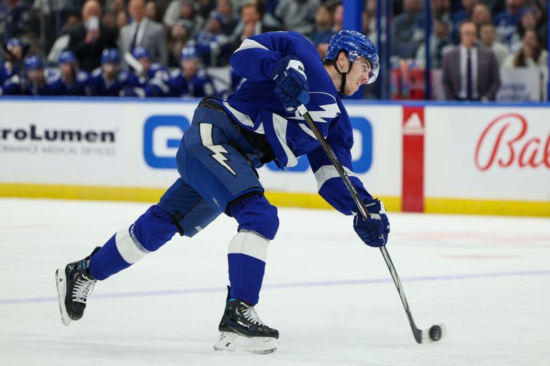 Feb 22, 2024; Tampa, Florida, USA;  Tampa Bay Lightning defenseman Haydn Fleury (7) shoots the puck against the Washington Capitals in the first period at Amalie Arena. Mandatory Credit: Nathan Ray Seebeck-USA TODAY Sports