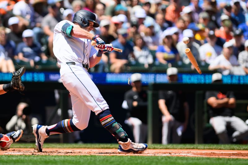 Jul 4, 2024; Seattle, Washington, USA; Seattle Mariners left fielder Luke Raley (20) breaks his bat on a ground out during the first inning against the Baltimore Orioles at T-Mobile Park. Mandatory Credit: Steven Bisig-USA TODAY Sports