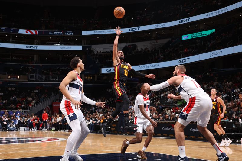 WASHINGTON, DC -? OCTOBER 30: Trae Young #11 of the Atlanta Hawks shoots the ball during the game against the Washington Wizards during a regular season game on October 30, 2024 at Capital One Arena in Washington, DC. NOTE TO USER: User expressly acknowledges and agrees that, by downloading and or using this Photograph, user is consenting to the terms and conditions of the Getty Images License Agreement. Mandatory Copyright Notice: Copyright 2024 NBAE (Photo by Kenny Giarla/NBAE via Getty Images)