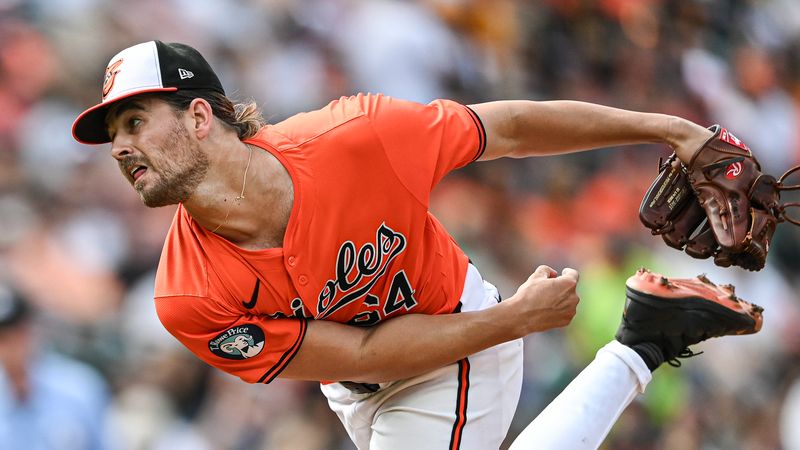 Jul 27, 2024; Baltimore, Maryland, USA; Baltimore Orioles pitcher Dean Kremer (64) delivers a twelfth inning pitch against the San Diego Padres  at Oriole Park at Camden Yards. Mandatory Credit: Tommy Gilligan-USA TODAY Sports