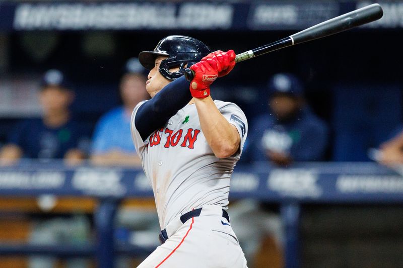 May 22, 2024; St. Petersburg, Florida, USA;  Boston Red Sox designated hitter Rob Refsnyder (30) hits an rub single against the Tampa Bay Rays in the fifth inning at Tropicana Field. Mandatory Credit: Nathan Ray Seebeck-USA TODAY Sports