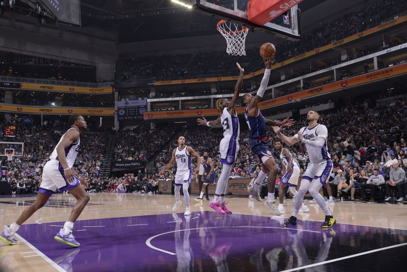 SACRAMENTO, CA - NOVEMBER 8: Kevin Porter Jr. #77 of the LA Clippers drives to the basket during the game against the Sacramento Kings on November 8, 2024 at Golden 1 Center in Sacramento, California. NOTE TO USER: User expressly acknowledges and agrees that, by downloading and or using this Photograph, user is consenting to the terms and conditions of the Getty Images License Agreement. Mandatory Copyright Notice: Copyright 2024 NBAE (Photo by Rocky Widner/NBAE via Getty Images)