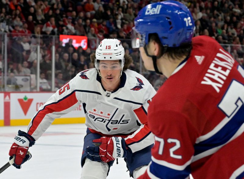 Feb 17, 2024; Montreal, Quebec, CAN; Washington Capitals forward Sonny Milano (15) forechecks on Montreal Canadiens defenseman Arber Xhekaj (72) during the third period at the Bell Centre. Mandatory Credit: Eric Bolte-USA TODAY Sports