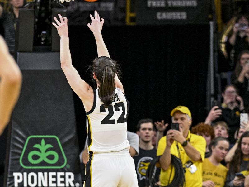 Mar 3, 2024; Iowa City, Iowa, USA; Iowa Hawkeyes guard Caitlin Clark (22) shoots a free throw during the second quarter to break the NCAA basketball all-time scoring record against the Ohio State Buckeyes. Mandatory Credit: Jeffrey Becker-USA TODAY Sports