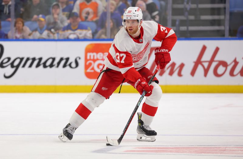 Dec 5, 2023; Buffalo, New York, USA;  Detroit Red Wings left wing J.T. Compher (37) carries the puck up ice during the third period against the Buffalo Sabres at KeyBank Center. Mandatory Credit: Timothy T. Ludwig-USA TODAY Sports