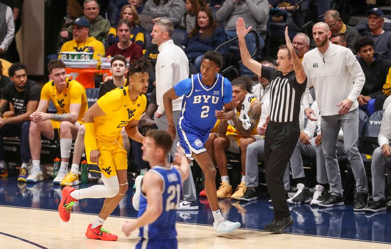 Feb 3, 2024; Morgantown, West Virginia, USA; Brigham Young Cougars guard Jaxson Robinson (2) celebrates a made three pointer during the first half against the West Virginia Mountaineers at WVU Coliseum. Mandatory Credit: Ben Queen-USA TODAY Sports