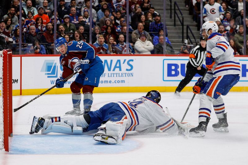 Jan 16, 2025; Denver, Colorado, USA; Edmonton Oilers goaltender Stuart Skinner (74) makes a save against Colorado Avalanche right wing Logan O'Connor (25) as defenseman Evan Bouchard (2) defends in the second period at Ball Arena. Mandatory Credit: Isaiah J. Downing-Imagn Images