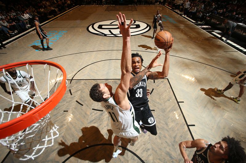 BROOKLYN, NY - DECEMBER 8: Nicolas Claxton #33 of the Brooklyn Nets shoots the ball during the game against the Milwaukee Bucks on December 8, 2024 at Barclays Center in Brooklyn, New York. NOTE TO USER: User expressly acknowledges and agrees that, by downloading and or using this Photograph, user is consenting to the terms and conditions of the Getty Images License Agreement. Mandatory Copyright Notice: Copyright 2024 NBAE (Photo by Nathaniel S. Butler/NBAE via Getty Images)