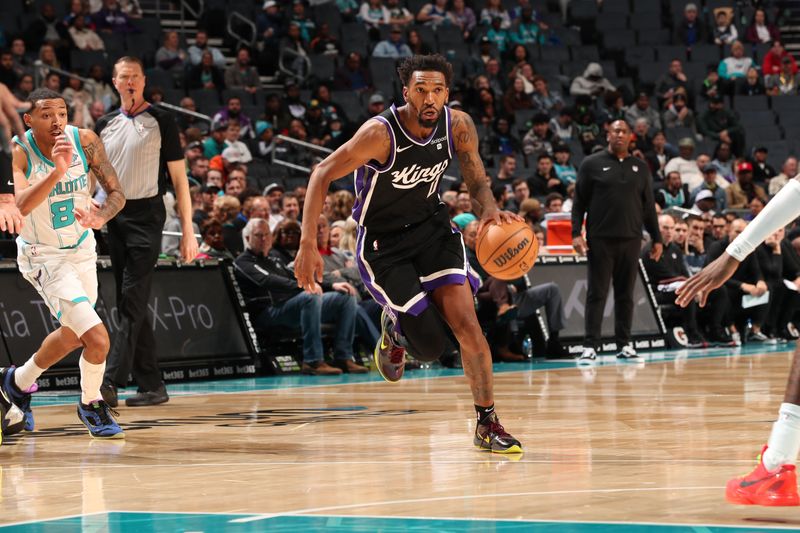 CHARLOTTE, NC - JANUARY 10: Malik Monk #0 of the Sacramento Kings dribbles the ball during the game against the Charlotte Hornets on January 10, 2024 at Spectrum Center in Charlotte, North Carolina. NOTE TO USER: User expressly acknowledges and agrees that, by downloading and or using this photograph, User is consenting to the terms and conditions of the Getty Images License Agreement. Mandatory Copyright Notice: Copyright 2024 NBAE (Photo by Kent Smith/NBAE via Getty Images)