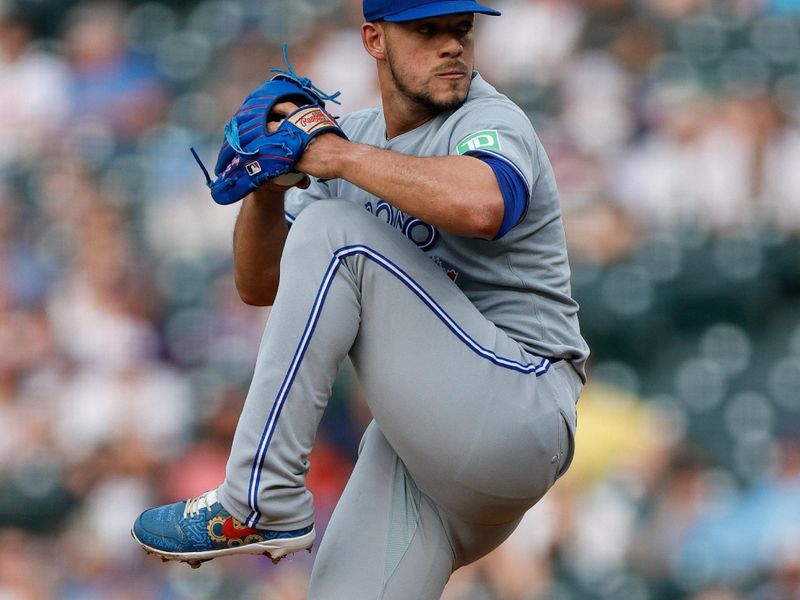 Aug 5, 2025; Denver, Colorado, USA; Toronto Blue Jays starting pitcher Jose Berrios (17) pitches in the first inning against the Colorado Rockies at Coors Field. Mandatory Credit: Isaiah J. Downing-Imagn Images