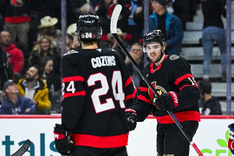 Dec 4, 2025; Ottawa, Ontario, CAN; Ottawa Senators right wing Drake Batherson (19) celebrates with center Dylan Cozens (24) his goal against the New York Rangers during the third period at Canadian Tire Centre. Mandatory Credit: David Kirouac-Imagn Images