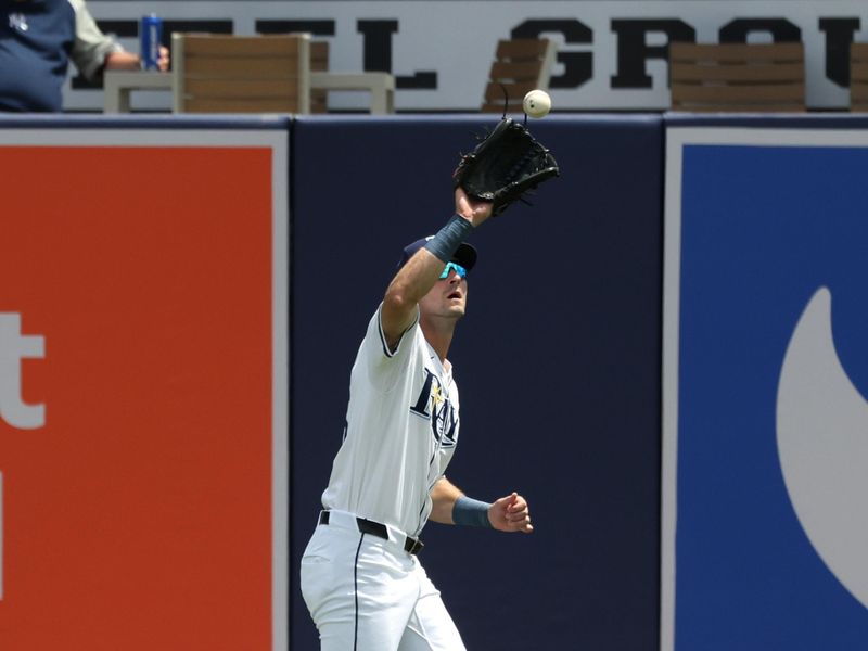 Apr 10, 2025; Tampa, Fl, USA;  Tampa Bay Rays outfielder Kameron Misner (26) catches a fly ball against the Los Angeles Angels during the first inning at George M. Steinbrenner Field. Mandatory Credit: Kim Klement Neitzel-Imagn Images