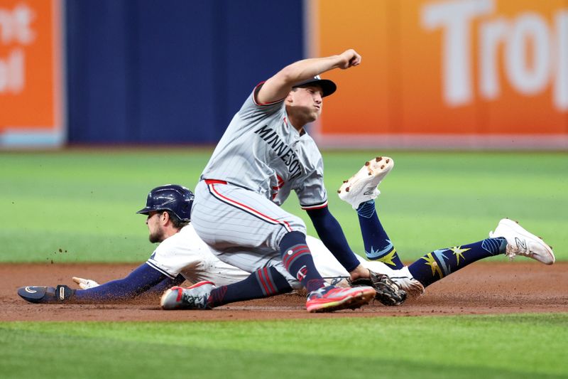 Sep 2, 2024; St. Petersburg, Florida, USA; Tampa Bay Rays outfielder Josh Lowe (15) steals second base from Minnesota Twins shortstop Brooks Lee (72) in the first inning at Tropicana Field. Mandatory Credit: Nathan Ray Seebeck-USA TODAY Sports