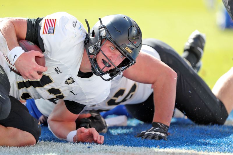 Nov 4, 2023; Denver, Colorado, USA; Army Black Knights quarterback Bryson Daily (13) scores a touchdown against the Air Force Falcons during the first half at Empower Field at Mile High. Mandatory Credit: Danny Wild-USA TODAY Sports