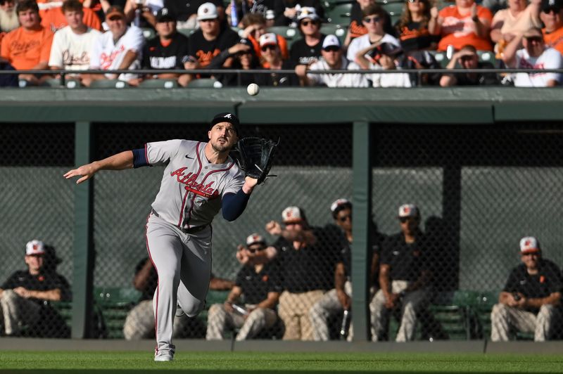 Jun 11, 2024; Baltimore, Maryland, USA; Atlanta Braves outfielder Adam Duvall (14) runs down Baltimore Orioles designated hitter Adley Rutschman  (not pictured) first inning fly ball  at Oriole Park at Camden Yards. Mandatory Credit: Tommy Gilligan-USA TODAY Sports