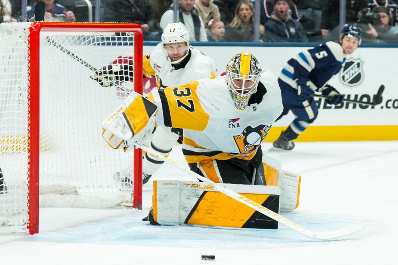 Jan 4, 2026; Columbus, Ohio, USA;  Pittsburgh Penguins goaltender Arturs Silovs (37) makes a save in net against the Columbus Blue Jackets in the first period at Nationwide Arena. Mandatory Credit: Aaron Doster-Imagn Images