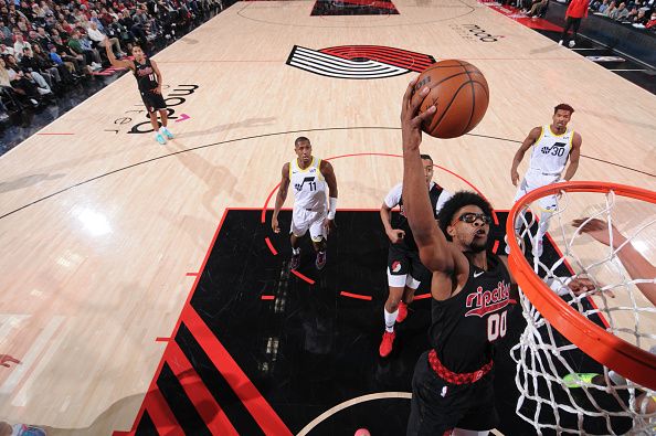 PORTLAND, OR - DECEMBER 14:  Scoot Henderson #00 of the Portland Trail Blazers goes to the basket during the game on December 14, 2023 at the Moda Center Arena in Portland, Oregon. NOTE TO USER: User expressly acknowledges and agrees that, by downloading and or using this photograph, user is consenting to the terms and conditions of the Getty Images License Agreement. Mandatory Copyright Notice: Copyright 2023 NBAE (Photo by Cameron Browne/NBAE via Getty Images)