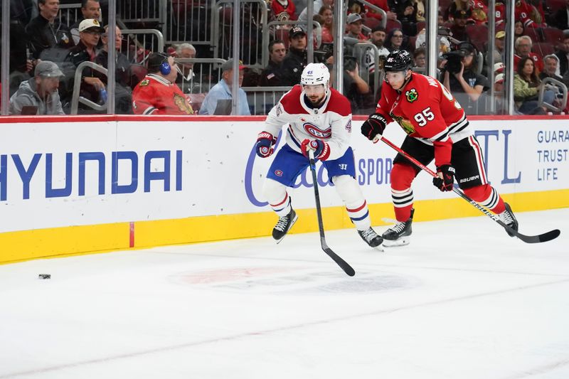 Oct 11, 2025; Chicago, Illinois, USA; Montréal Canadiens defenseman Alexandre Carrier (45) and Chicago Blackhawks right wing Ilya Mikheyev (95) go for the puck during the third period at United Center. Mandatory Credit: David Banks-Imagn Images