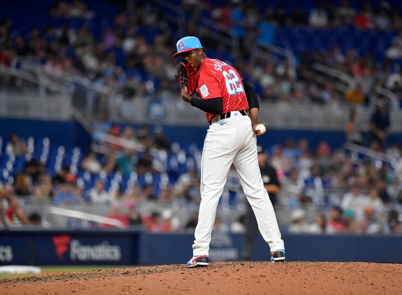 May 11, 2024; Miami, Florida, USA;  Miami Marlins pitcher George Soriano (62) looks at first base during the ninth inning against the Philadelphia Phillies at loanDepot Park. Mandatory Credit: Michael Laughlin-USA TODAY Sports