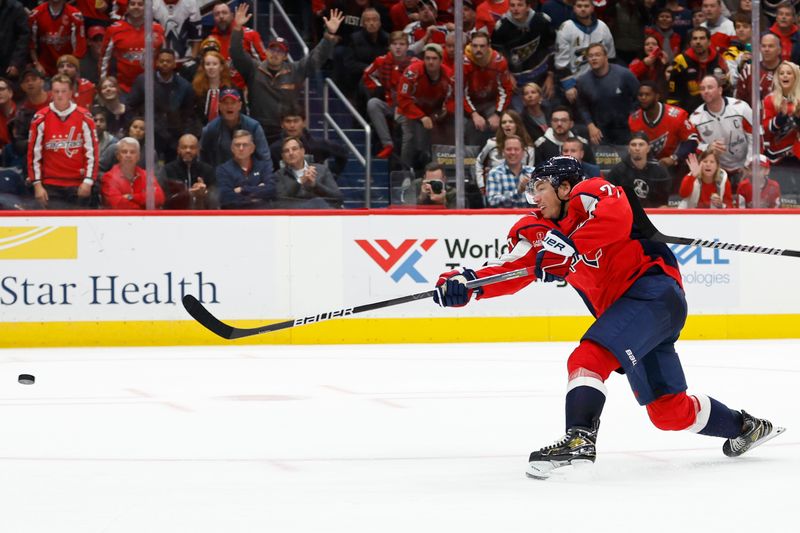 Oct 16, 2023; Washington, District of Columbia, USA; Washington Capitals right wing T.J. Oshie (77) shoots the puck against the Calgary Flames in the third period at Capital One Arena. Mandatory Credit: Geoff Burke-USA TODAY Sports