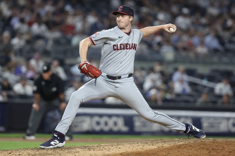 Jun 4, 2025; Bronx, New York, USA;  Cleveland Guardians relief pitcher Tim Herrin (29) pitches in the seventh inning against the New York Yankees at Yankee Stadium. Mandatory Credit: Wendell Cruz-Imagn Images