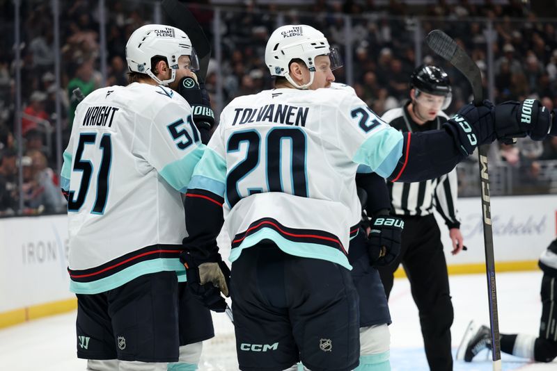 Feb 4, 2026; Los Angeles, California, USA;  Seattle Kraken center Shane Wright (51) celebrates with right wing Eeli Tolvanen (20) after scoring a goal during the third period against the Los Angeles Kings at Crypto.com Arena. Mandatory Credit: Kiyoshi Mio-Imagn Images
