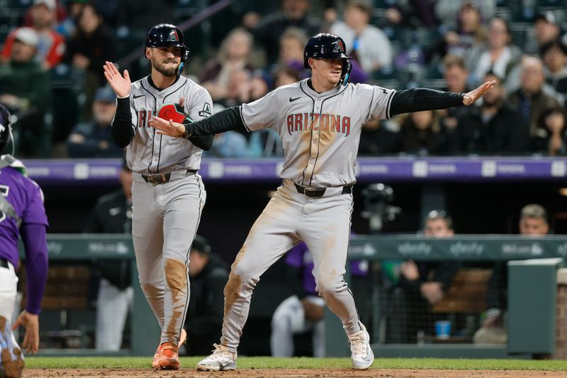 Apr 8, 2024; Denver, Colorado, USA; Arizona Diamondbacks shortstop Kevin Newman (18) reacts ahead of designated hitter Blaze Alexander (9) in the fourth inning against the Colorado Rockies at Coors Field. Mandatory Credit: Isaiah J. Downing-USA TODAY Sports