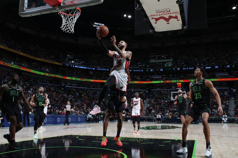 NEW ORLEANS, LA - FEBRUARY 23: Caleb Martin #16 of the Miami Heat drives to the basket during the game against the New Orleans Pelicans on February 23, 2024 at the Smoothie King Center in New Orleans, Louisiana. NOTE TO USER: User expressly acknowledges and agrees that, by downloading and or using this Photograph, user is consenting to the terms and conditions of the Getty Images License Agreement. Mandatory Copyright Notice: Copyright 2024 NBAE (Photo by Layne Murdoch Jr./NBAE via Getty Images)