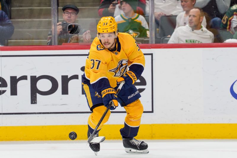 Nov 4, 2025; Saint Paul, Minnesota, USA; Nashville Predators defenseman Nick Blankenburg (37) controls the puck against the Minnesota Wild in the second period at Grand Casino Arena. Mandatory Credit: Matt Blewett-Imagn Images