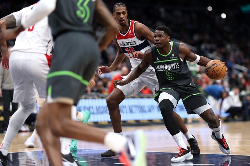 WASHINGTON, DC - JANUARY 13: Anthony Edwards #5 of the Minnesota Timberwolves dribbles the ball past Alexandre Sarr #20 of the Washington Wizards during the first half at Capital One Arena on January 13, 2025 in Washington, DC. NOTE TO USER: User expressly acknowledges and agrees that, by downloading and or using this photograph, User is consenting to the terms and conditions of the Getty Images License Agreement. (Photo by Patrick Smith/Getty Images)